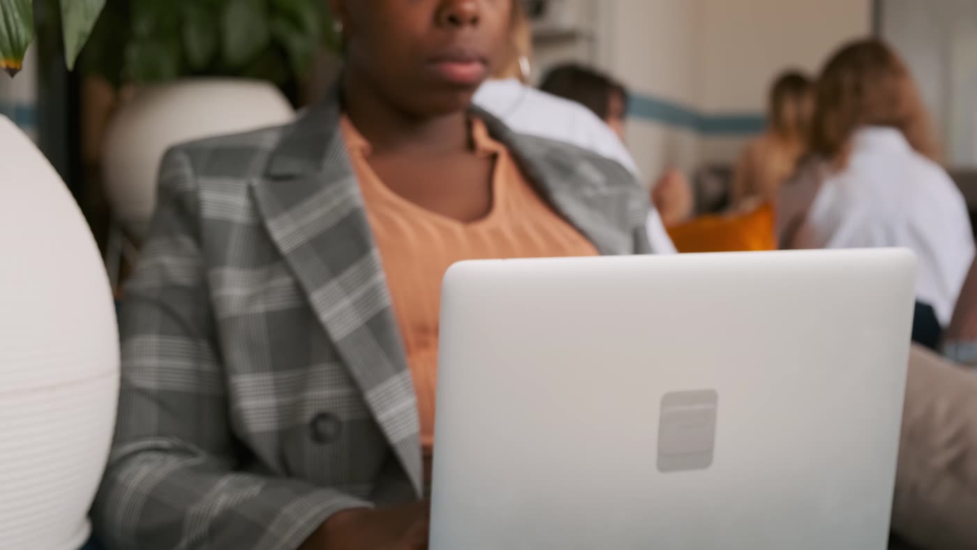 Member working with a laptop at a café