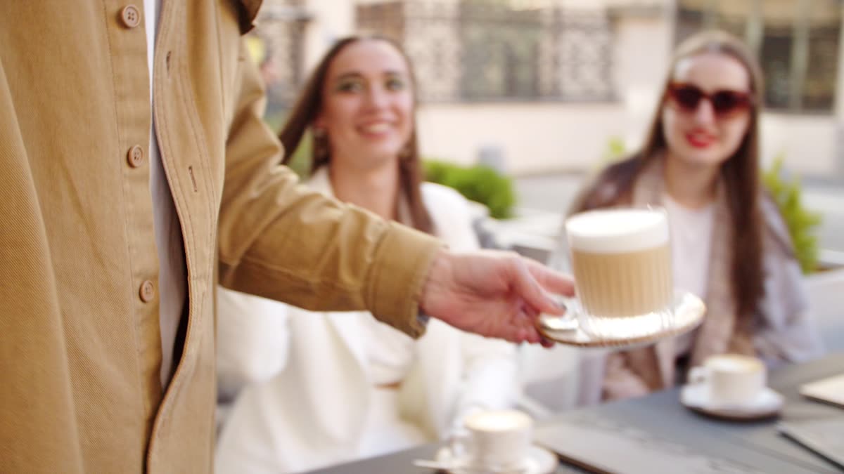 Coffee being served at a café table